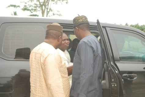 Ambode (middle) discussing with close associates